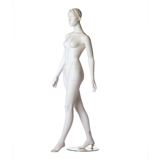 Stylised female mannequin from Hindsgaul in a walking pose.
