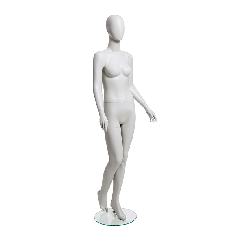 Female mannequin from Darrol, walking with right leg bent. Abstract head.