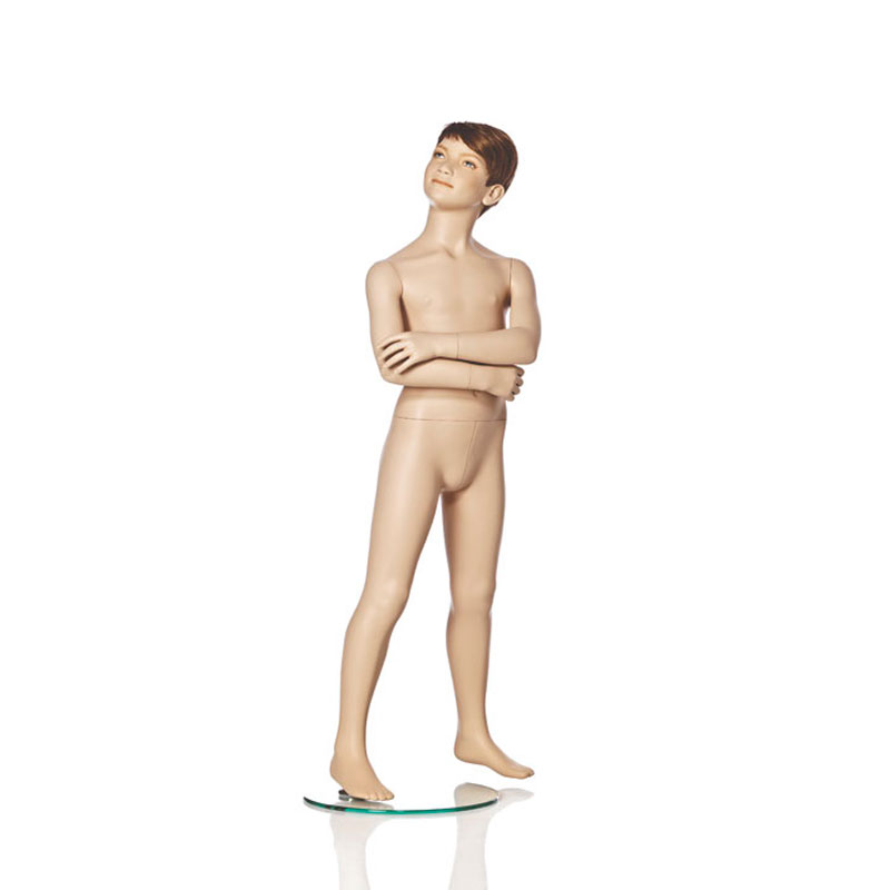 Realistic boy mannequin in standing pose.