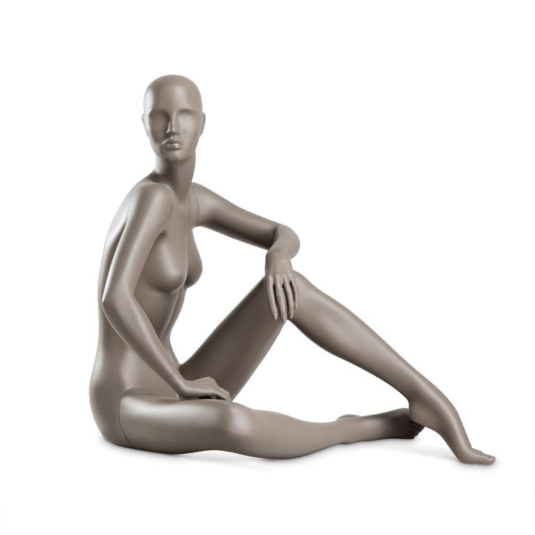 Female mannequin from Hindsgaul® sitting. COY is a semi-faceless, female mannequin series with 9 poses reflecting a confident and feminine attitude.