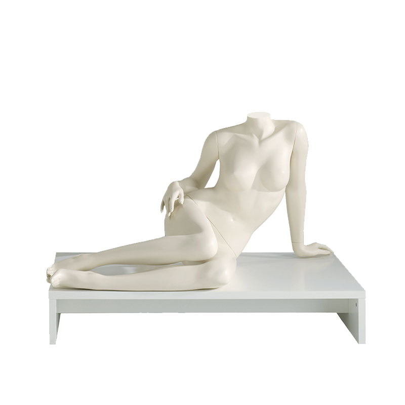 Headless sitting female mannequin.